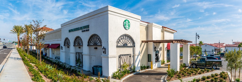 Retail property exterior used as backdrop for syndication education